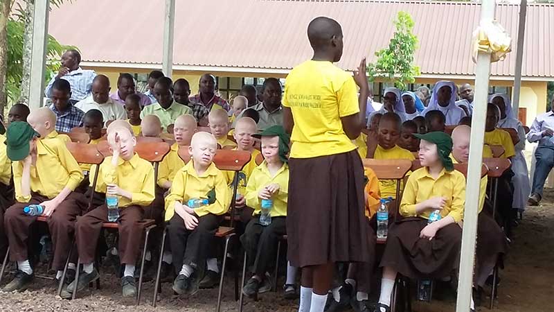 Albinism-and-student-signing-for-hearing-impaired-at-opening-for-St-Pamachius